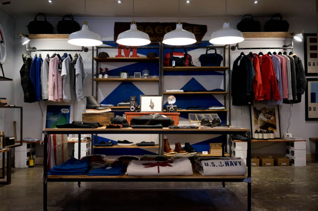 Example of the visual merchandising of a fashion store with clothes on shelves